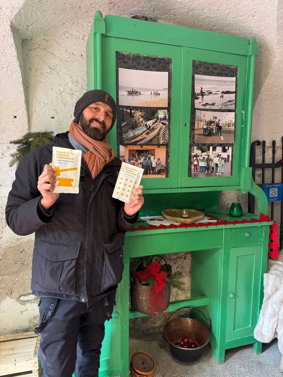 Riccardo with chocolate and photos from Sierra Leone